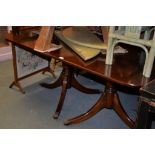 A modern mahogany twin pedestal dining table, with single additional leaf, approx. 210cm long