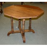 A Victorian oak octagonal occasional table, with one drop end, 70cm high, 95cm wide overall