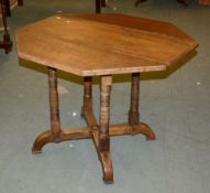 A Victorian oak octagonal occasional table, with one drop end, 70cm high, 95cm wide overall