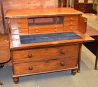 A Victorian mahogany secretaire chest, the top drawer with fall enclosing arrangement of short