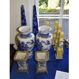 Four modern Far Eastern porcelain yellow-ground obelisks; a pair of similar and larger blue