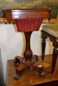 Ω A William IV rosewood work table, the fitted interior with marbled paper linings and some