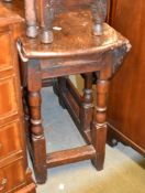 An oak drop leaf table, with baluster turned supports, 65cm high