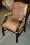 A leather upholstered armchair in George III style, of Gainsborough type