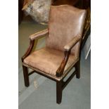 A leather upholstered armchair in George III style, of Gainsborough type