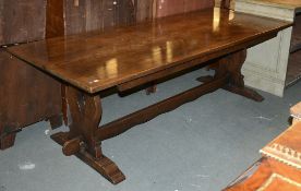 A large oak refectory table in 17th century style, and a set of eight studded leather upholstered