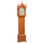 An oak longcase clock, with eight-day bell striking movement, the arched Roman numeral dial with