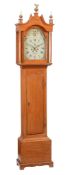 An oak longcase clock, with eight-day bell striking movement, the arched Roman numeral dial with