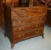 A George III mahogany secretaire chest, the fall enclosing an arrangement of drawers and