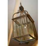 A brass and glazed hall lantern, circa 1900, of square section, 64cm high