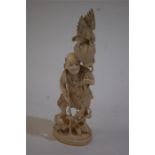 A FINE LATE 19TH CENTURY JAPANESE MEIJI PERIOD IVORY OKIMONO of A Fisherman With Basket And Eagle