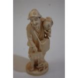 A LATE 19TH CENTURY JAPANESE MEIJI PERIOD IVORY of An Old Woman Holding a Lantern And Sweeping Brush