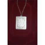 A Stirling Silver Valentine Pendant on Silver Chain Embossed With A True Love Knot To Both Sides