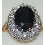 18 ct Gold/White Gold Dress Ring, Large Claw Set Sapphire Surrounded by Diamonds With Earrings.