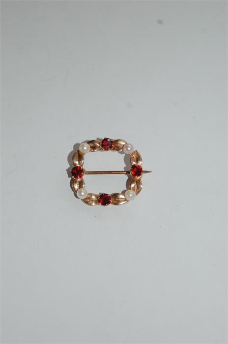 A 9 Carat Gold Brooch Set Four Pearls, Four Garnets