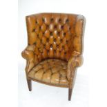 An Early Reproduction Brown Leather Tub Wing-back Studded Library Chair