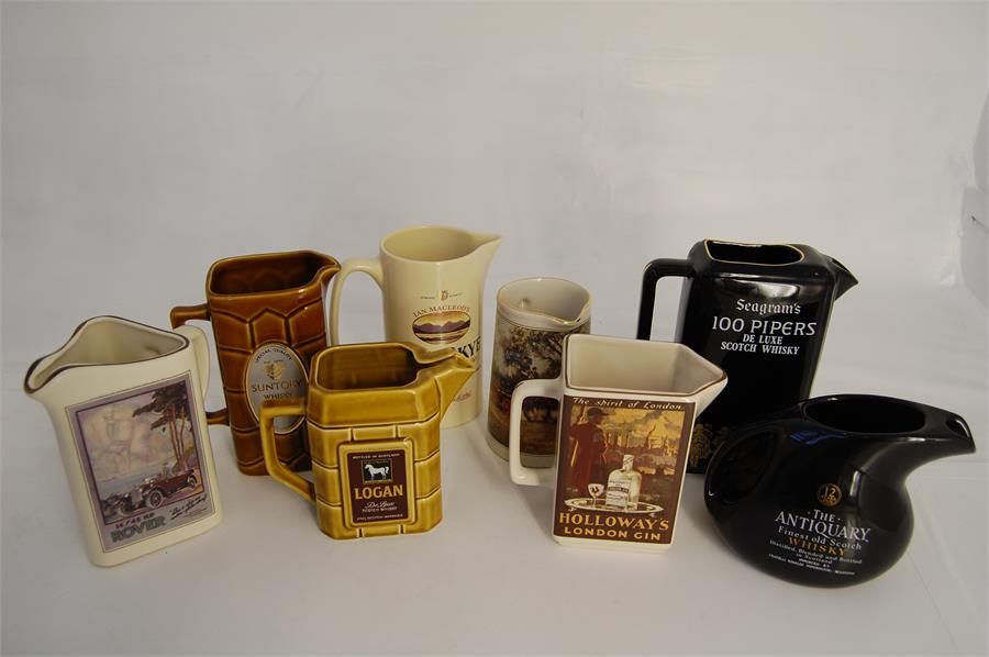 A Collection of Vintage Whisky Water Jugs
