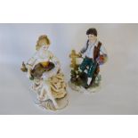Two Porcelain Figurines of Girl Holding a Lamb together with Boy a Holding Bunch of Flowers