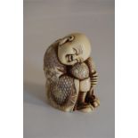 19th Century Carved Ivory/ Ivorine Okimono of a Young Child Sitting