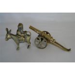 Small Brass Cannon on Brass Carriage together with a Brass Seated Man Rear Facing on a Donkey