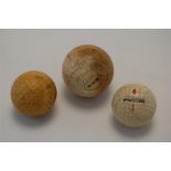 Two Vintage Golf Balls together with a Heavy Turned Bone/Ivory Ball