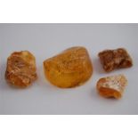 Pieces of Amber, the larger piece 2.5cm diameter approx.