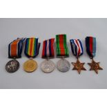 A Group of WWI + WWII Medals all with Ribbons