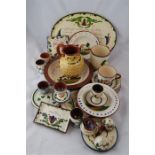 A Collection of Torquay Ware Platters, Mugs Plates, Egg cups, etc, 19 in all