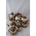 A Collection of Torquay Ware Tea and Coffee Pots, 9 in all
