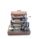 A Vintage Singer Sewing Machine together with Vintage Harris Sewing Machine
