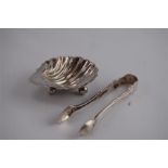 A Small Silver Dish in the Shape of a Shell, Together with a Pair of Sugar Tongs, London 1916