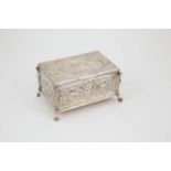 Dutch S/S Oblong Casket ornately chased all-over with cherubs in a landscape, birds, masks and