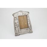 Art Nouveau S/S Photo Frame cast in low relief with a mother and child to one side and flowering
