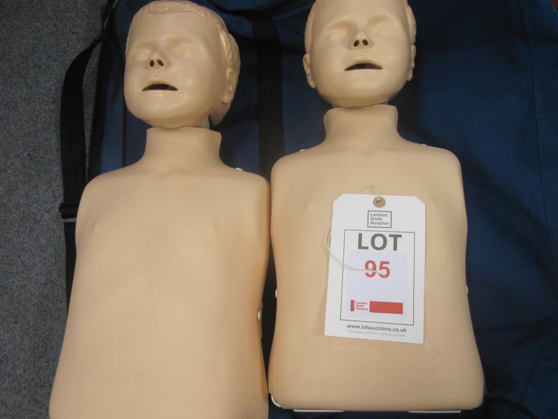 Two Laerdal Little Junior CPR training manikins and carry case