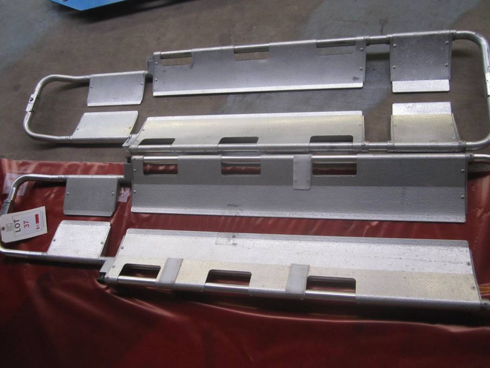 Two metal folding spinal boards