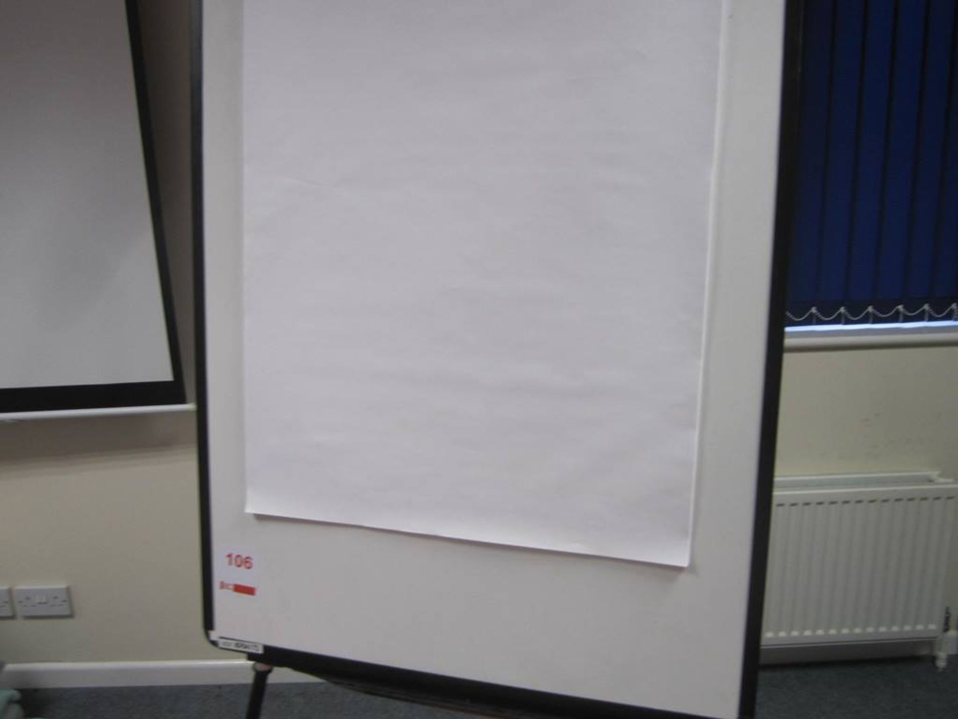 Flip chart mounted on tripod stand with flipchart