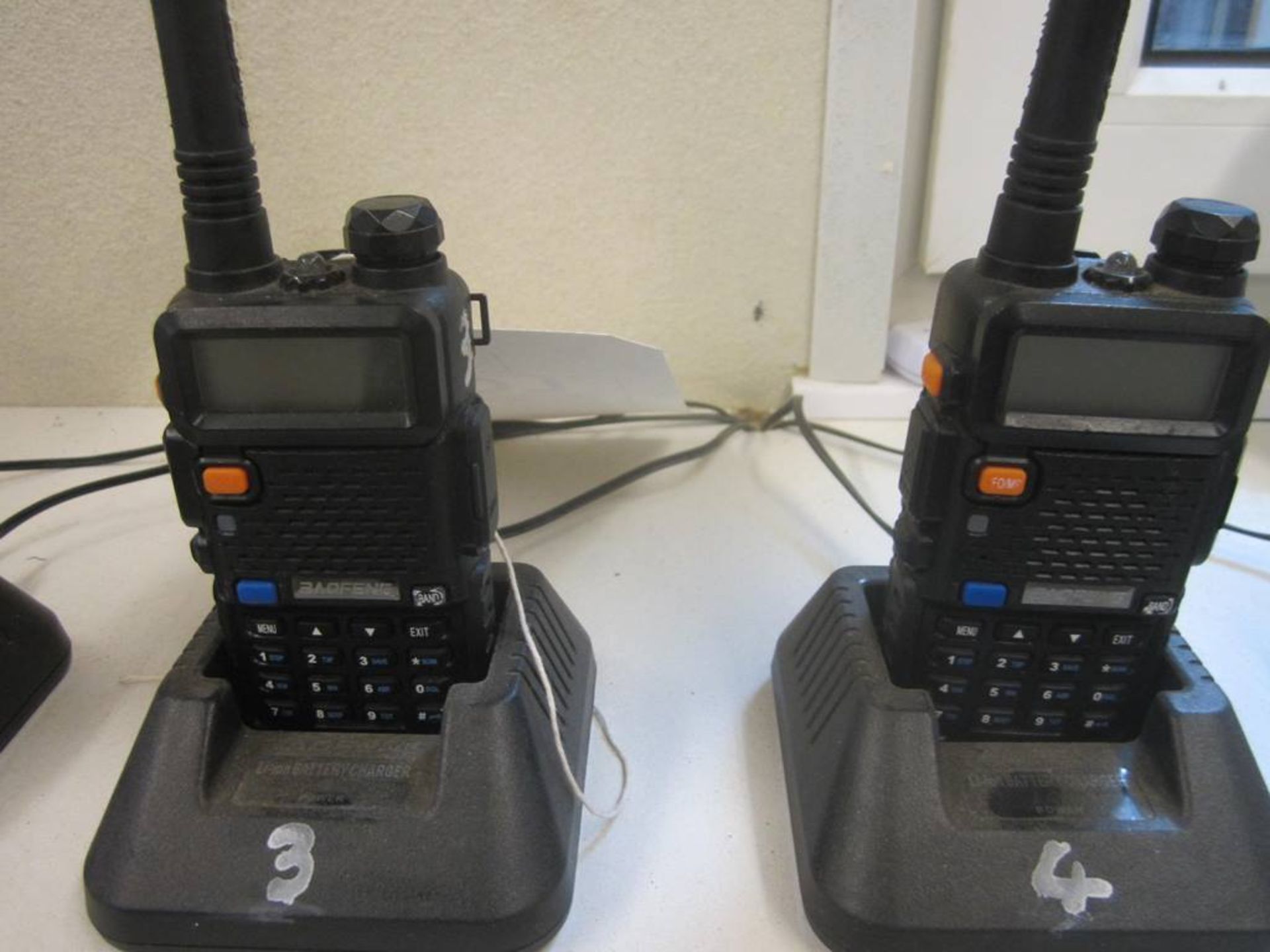 Two Boafeng UV-5R 2-way radio sets and charging stations