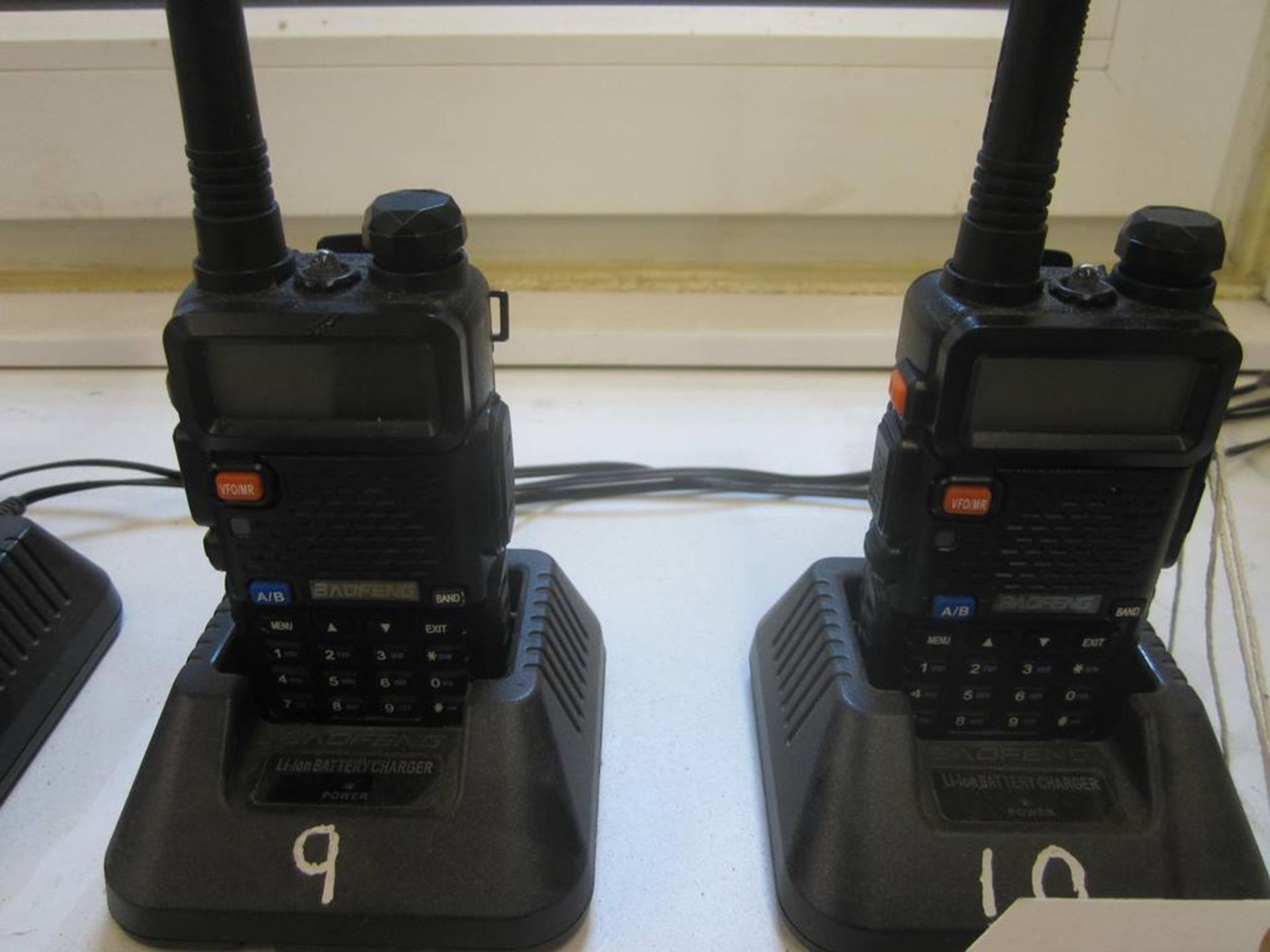Two Boafeng UV-5R 2-way radio sets and charging stations