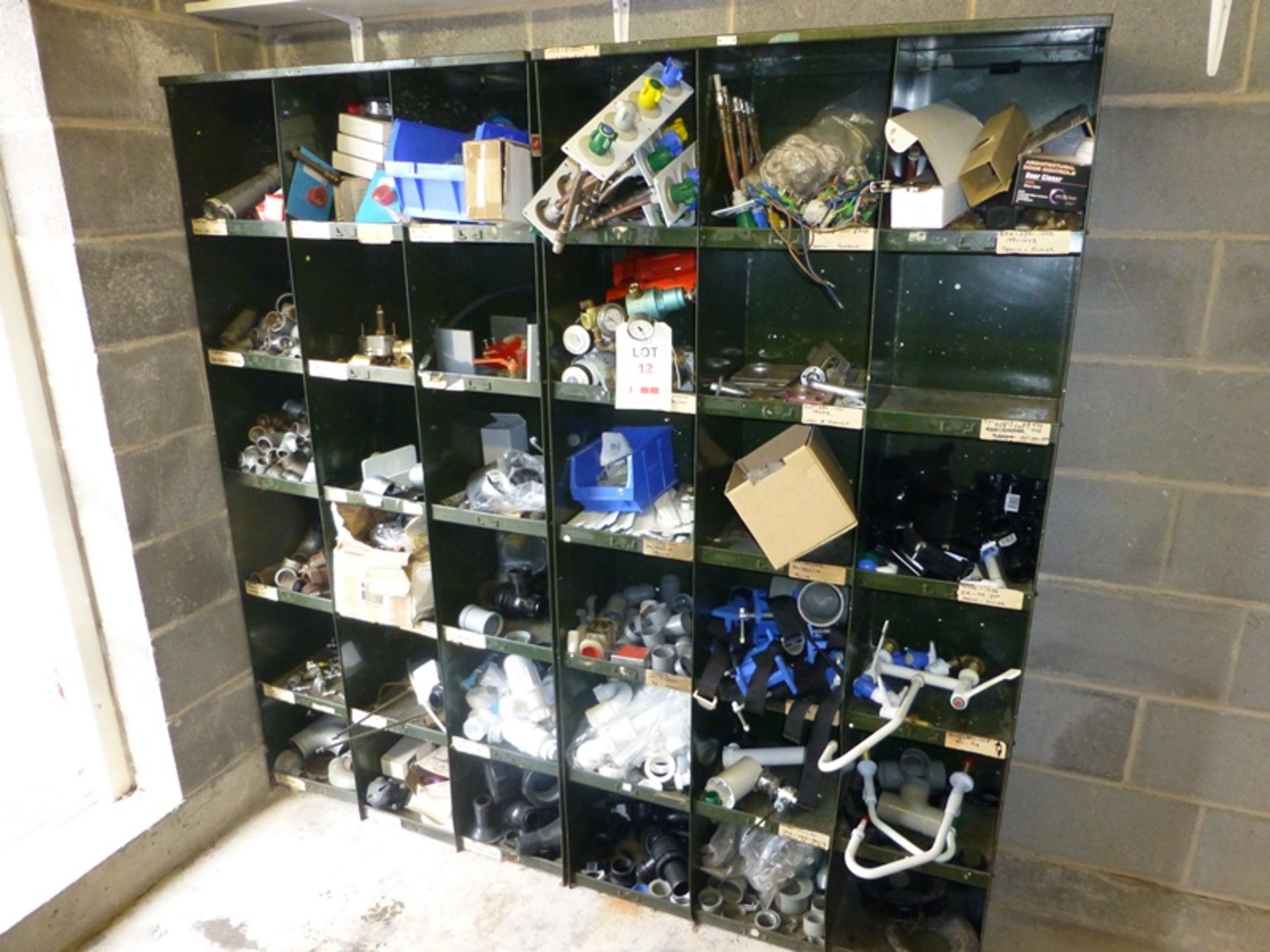 2, 18 compartment pigeon hole racks and contents including pipe fittings, gas fittings, taps and