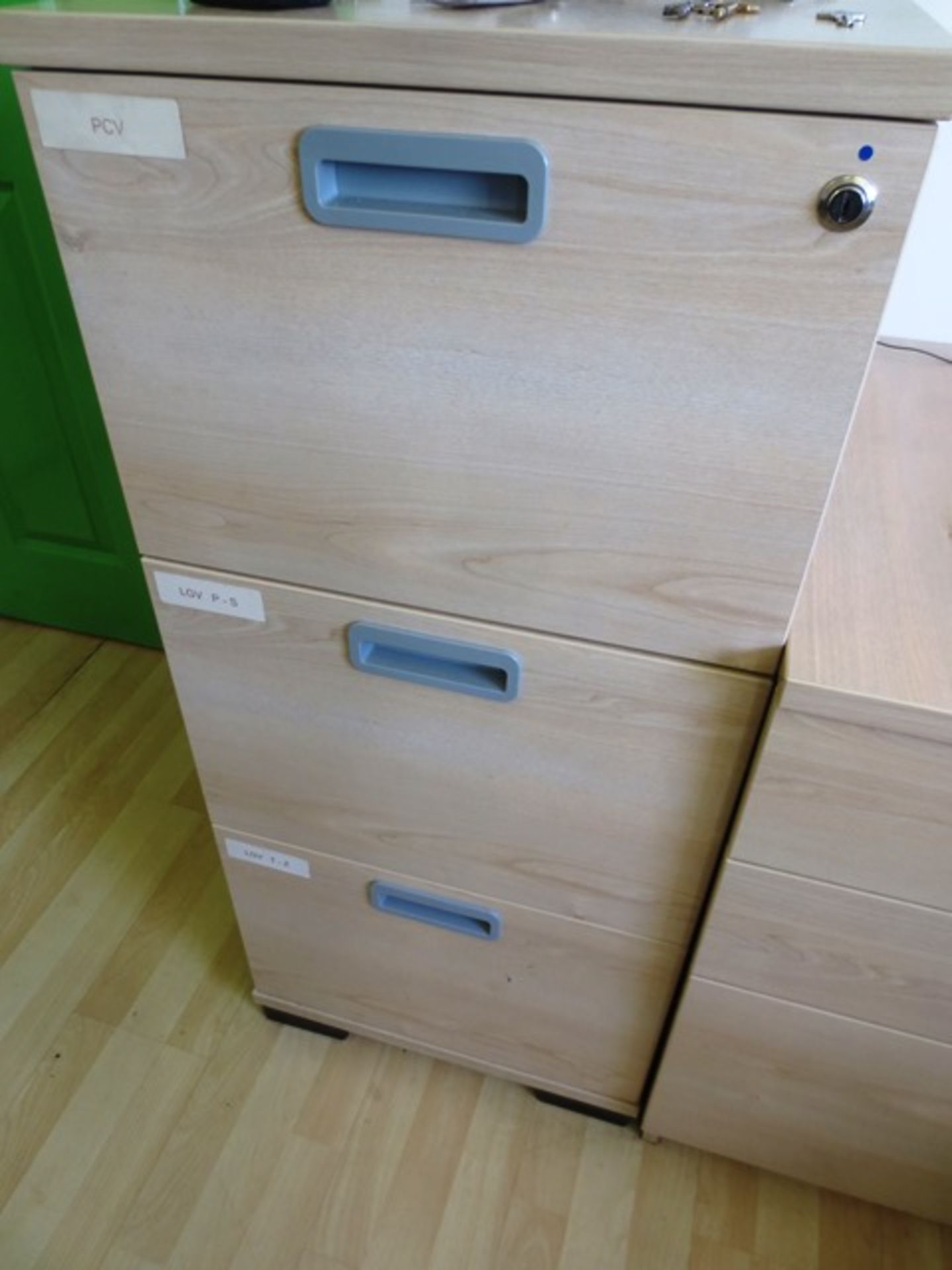 Two light oak effect 3 drawer filing cabinets (only one in image)