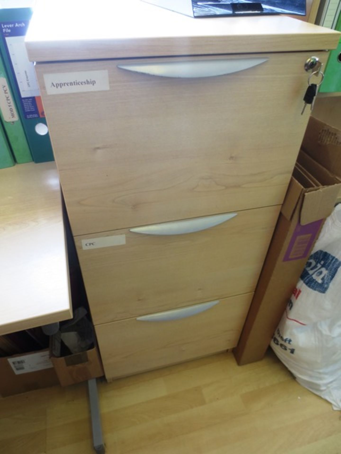 Two light oak effect 3 drawer filing cabinets (only one in image)