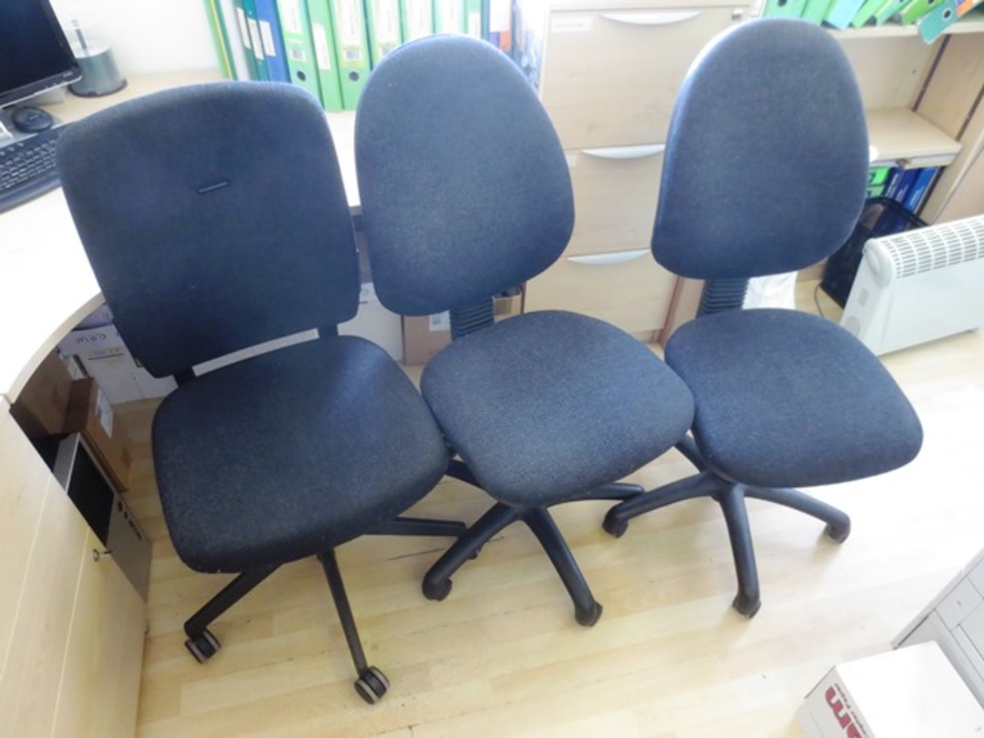 Three grey cloth upholstered office swivel chairs