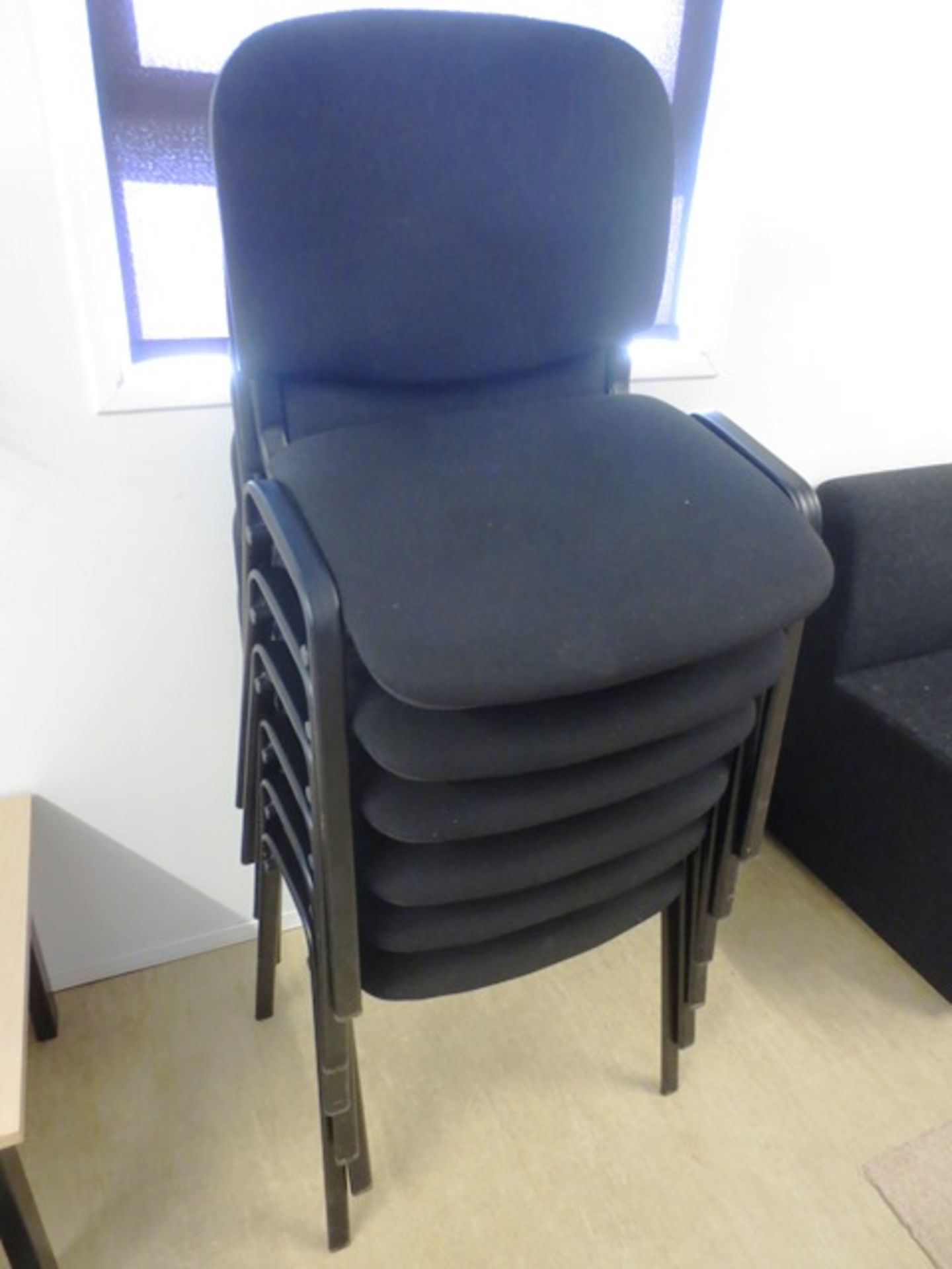 Six black cloth upholstered chairs