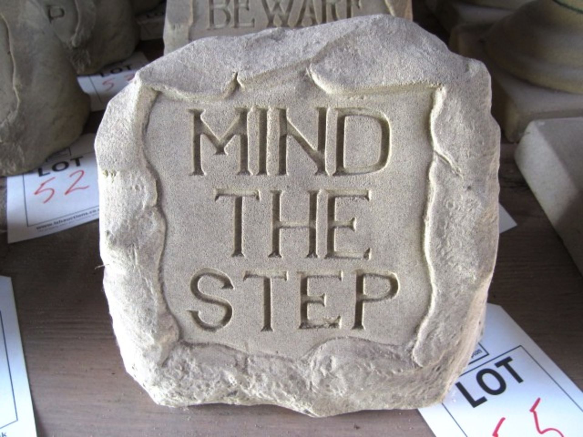 Reconstituted concrete stone slogan name plaque, "Mind The Step", approx. dimensions: length 260mm