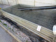 Approx twelve Heras fence panels and two pallets of associated rubber panel supports