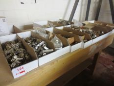 Nine boxes of assorted kitchen fittings, including hinges, etc.