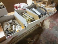 Nine boxes of assorted stock, including letterboxes, window handles, brackets, etc.