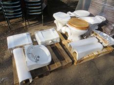 Two pallets of assorted bathroomware, including four toilets, two cisterns, two sinks, three