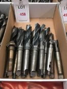 Quantity of tapered shank drill bits and sleaves in three boxes