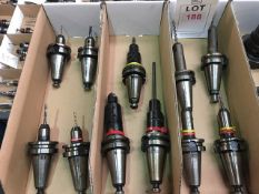 Eleven BT40 taper shank tool holders, fitted tooling, in three boxes